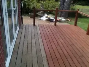 Exterior decking having the first coat of golden Cedar stain applied