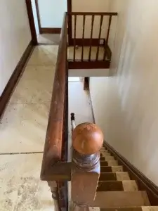 Top landing showing dark stained and varnished woodwork