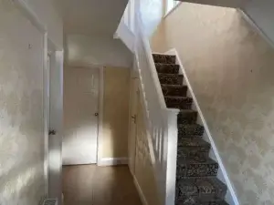 Main hallway entrance with older styled wallpaper